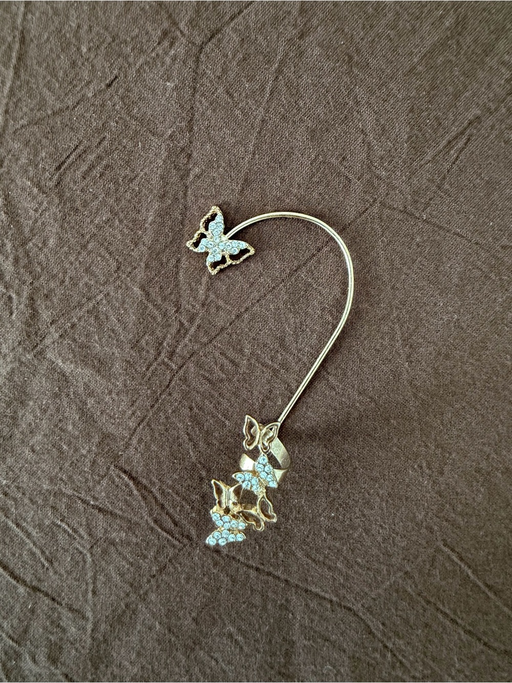 Claire’s butterfly ear cuff